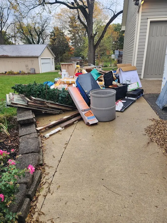 Dumpster being loaded with debris for 30 Yard Dumpster Rental in Mayfield
